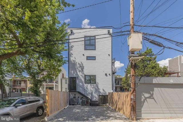a view of a house with wooden fence