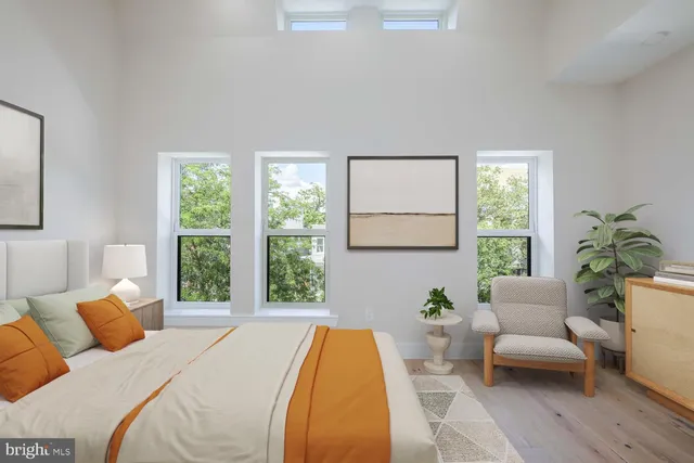 a bedroom with a bed and a couch