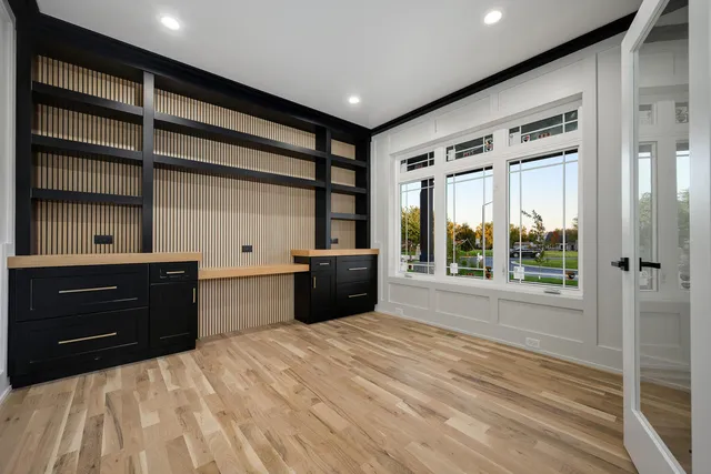 a room with a bed and a dresser