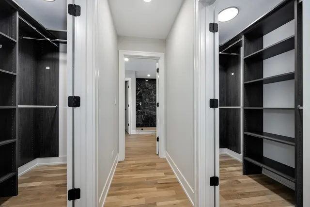 a bathroom with a double vanity sink and mirror