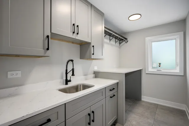 a front view of a house with yard and green space