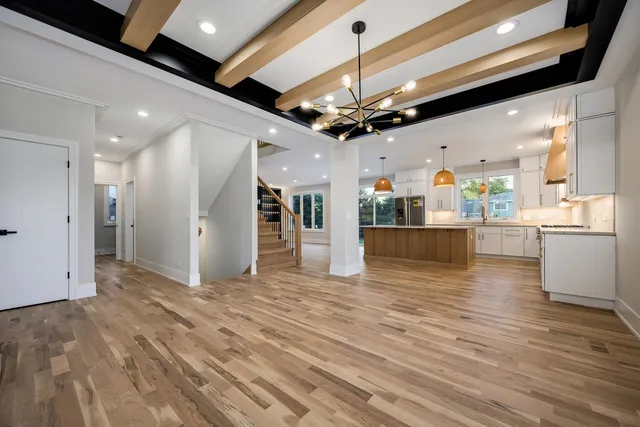 a view of a kitchen with a refrigerator and a microwave