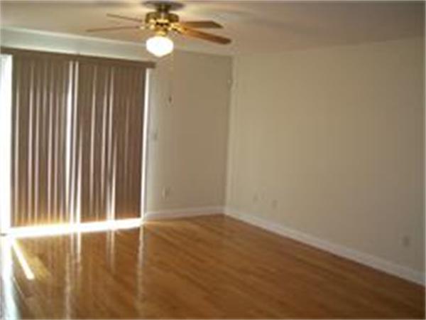 1 Village Way, Unit 1 Rutland, MA 01543 - Photo 5 of 16 a view of wooden floor and chandelier fan in a room