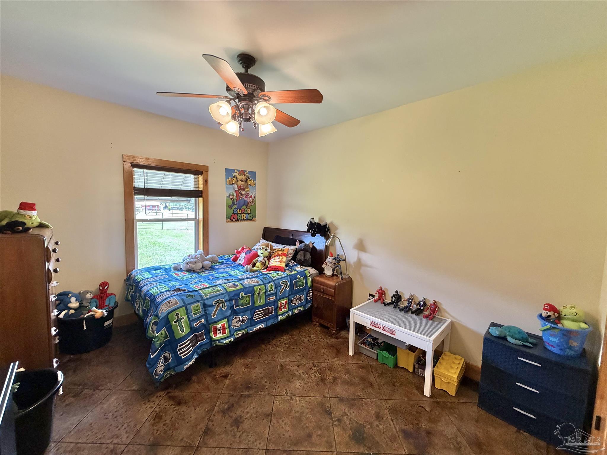 145 Tower Road Uriah, AL 36480 - Photo 21 of 72 a bedroom with a bed and a chandelier