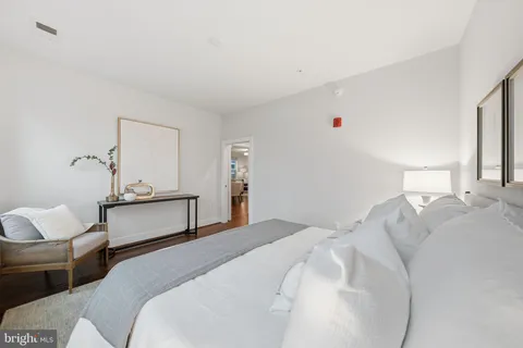 a bedroom with bed and window