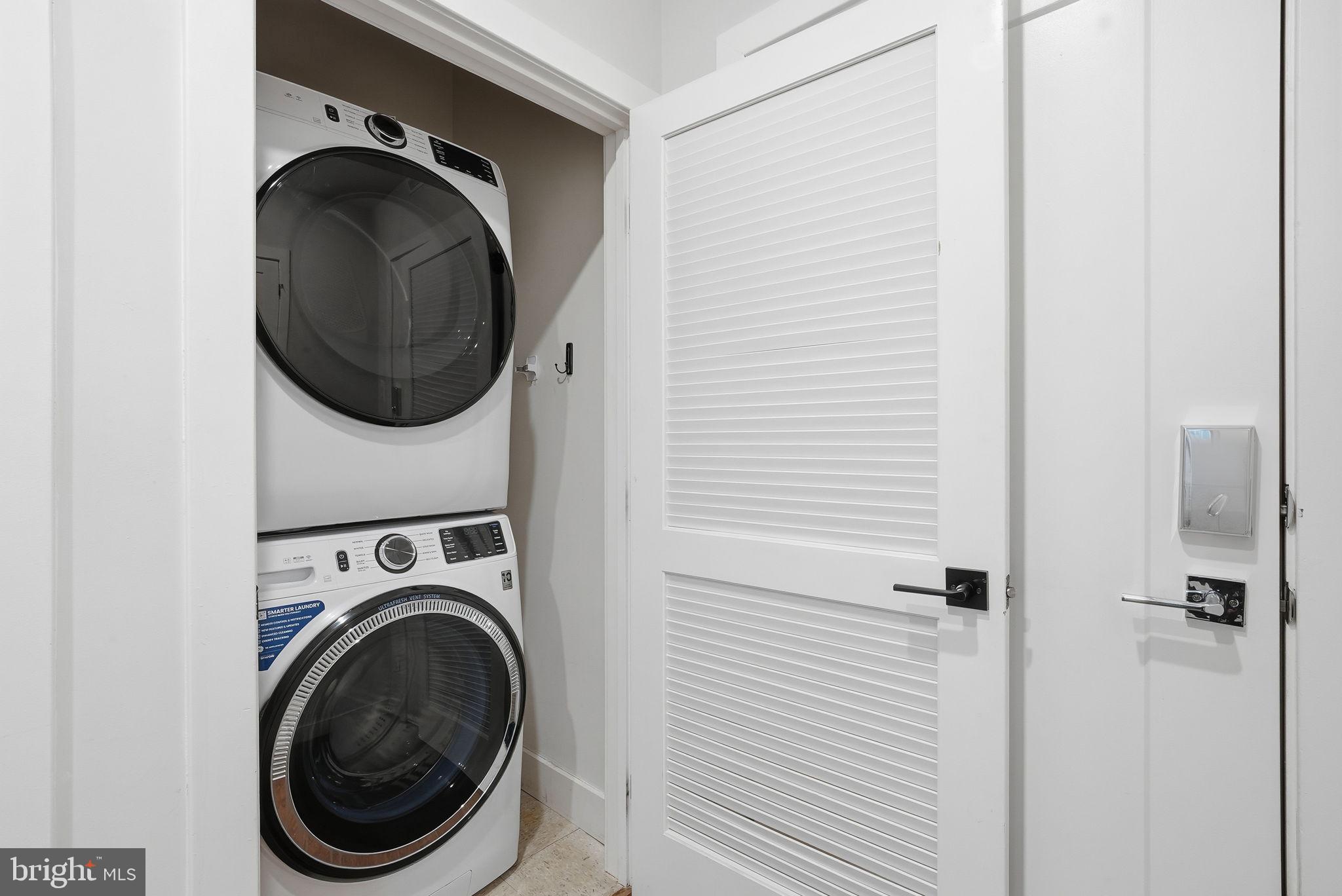 1411 Key Boulevard, Unit 505 Arlington, VA 22209 - Photo 19 of 26 a close view of a utility room with dryer and washer
