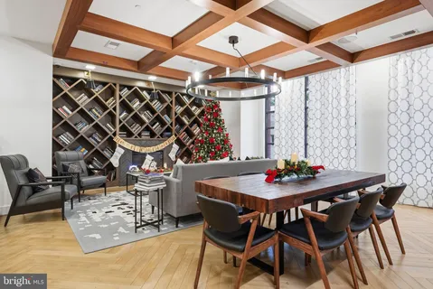 a table and chairs in front of a glass door