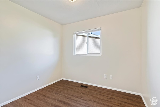 947 Canyon Road South, Unit 15 Ogden, UT 84404 - Photo 18 of 22 Unfurnished room with baseboards and dark wood finished floors