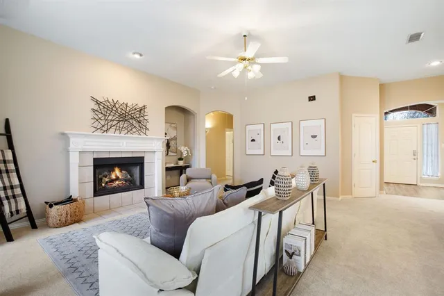 a living room with furniture and a fireplace