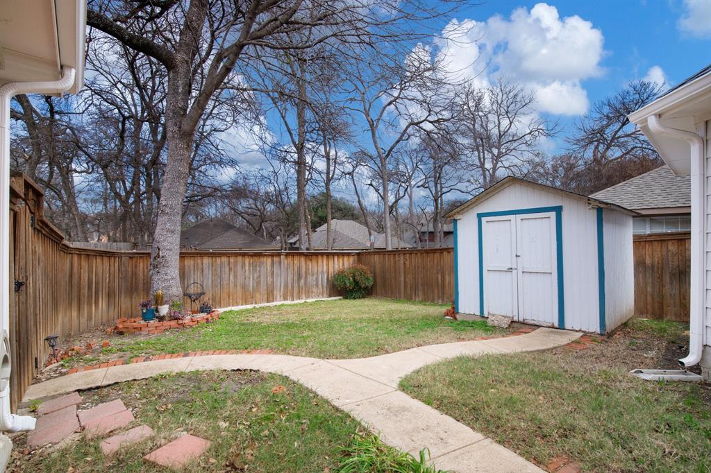 921 West Muirfield Road Garland, TX 75044 - Photo 29 of 33 a view of a back yard of the house