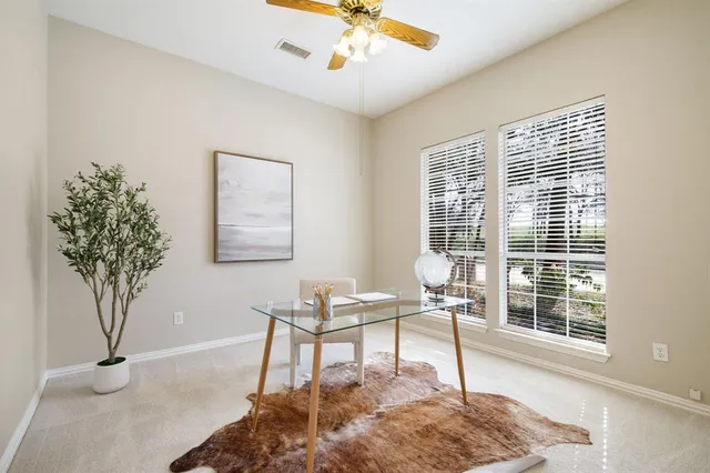 a workspace with furniture and a window