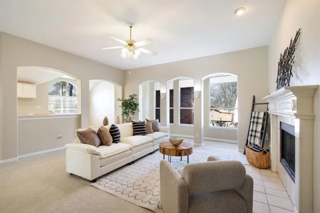 a living room with furniture and a fireplace