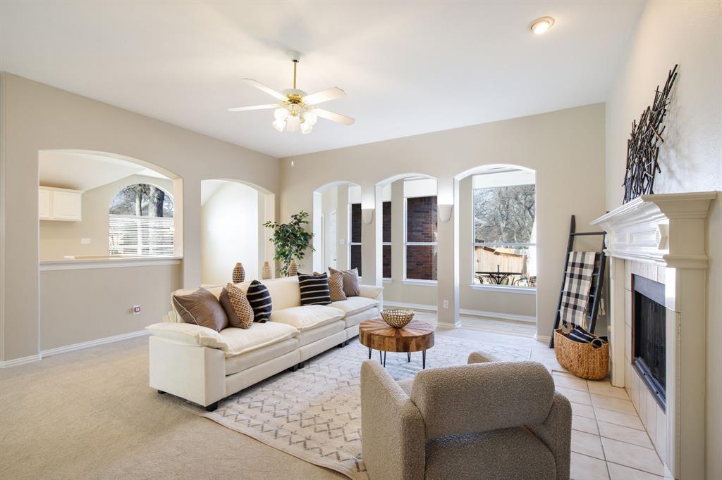 921 West Muirfield Road Garland, TX 75044 - Photo 7 of 33 a living room with furniture and a fireplace