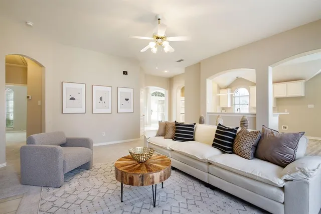 a living room with furniture and a large window