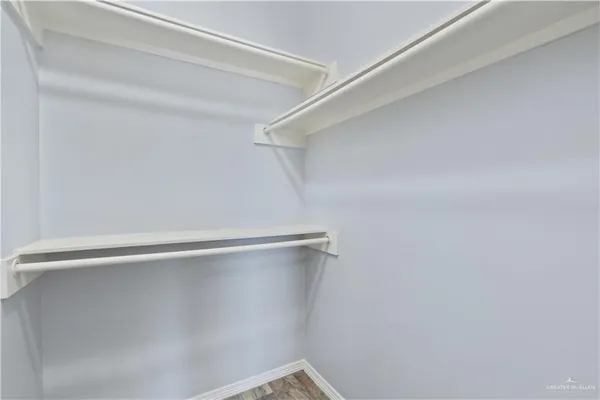 a view of a room with shelf on the wall