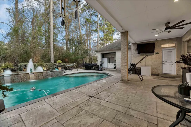 a view of a swimming pool with outdoor seating