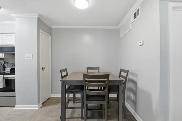 a view of a dining room with furniture