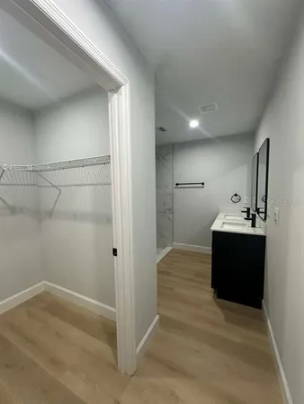 a room with a sink and a mirror