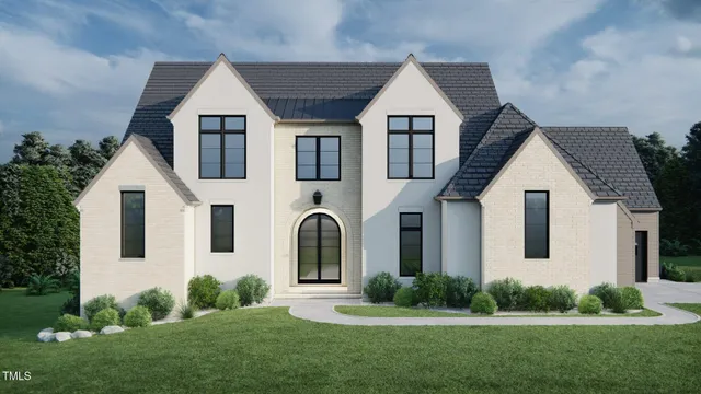 a view of a white house with a yard and plants