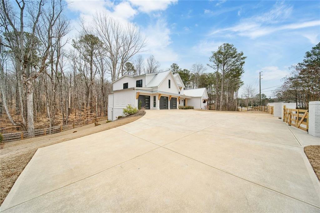 555 Lower Birmingham Road Canton, GA 30115 - Photo 15 of 104 a view of a building with snow on the road