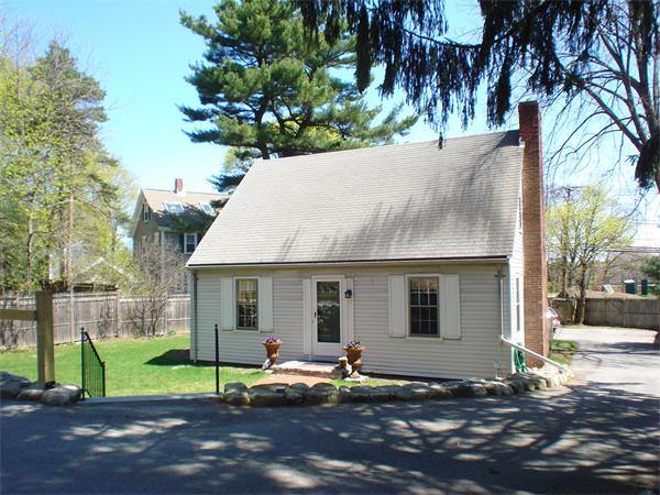 7 Loring Road Weston, MA 02493 - Photo 1 of 20 a backyard of a house with barbeque oven table and chairs