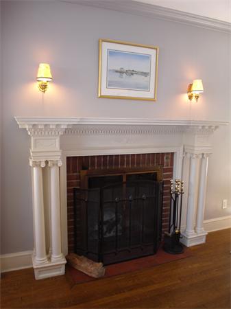 7 Loring Road Weston, MA 02493 - Photo 12 of 20 a living room with furniture and a fireplace