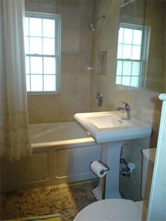 7 Loring Road Weston, MA 02493 - Photo 14 of 20 a bathroom with a sink a toilet and tub