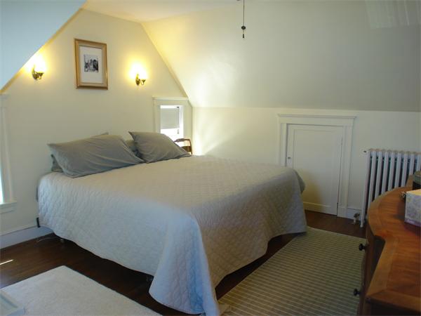 7 Loring Road Weston, MA 02493 - Photo 16 of 20 a bedroom with a bed and wooden floor