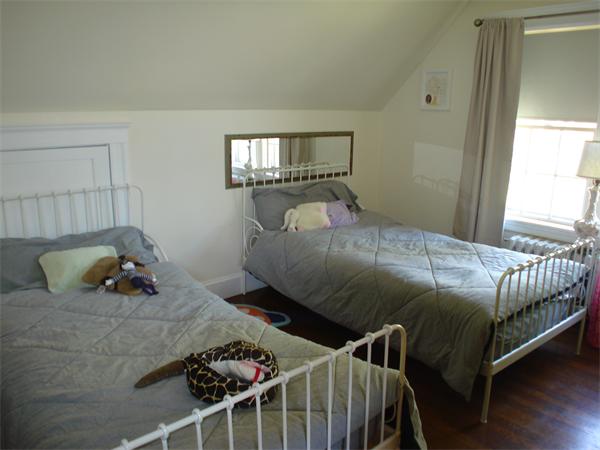 7 Loring Road Weston, MA 02493 - Photo 17 of 20 a bedroom with a bed and window