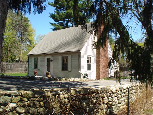 7 Loring Road Weston, MA 02493 - Photo 2 of 20 a front view of a house with a yard covered with snow