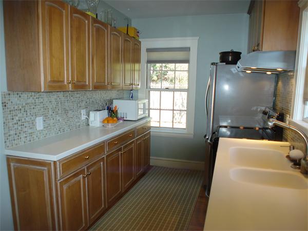 7 Loring Road Weston, MA 02493 - Photo 7 of 20 a kitchen with a sink cabinets and wooden floor