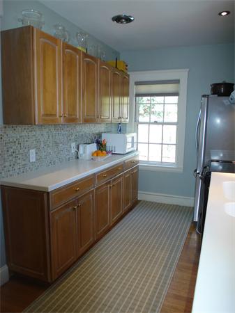 7 Loring Road Weston, MA 02493 - Photo 10 of 20 a kitchen with stainless steel appliances sink cabinets and window