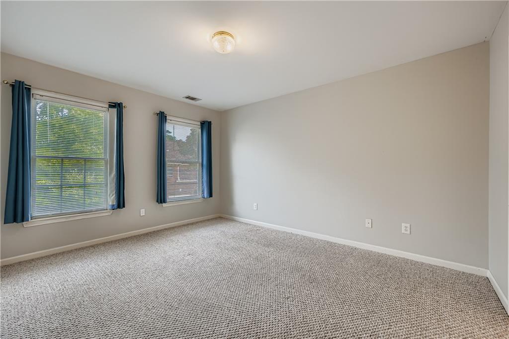 1581 Oak Park Cove Decatur, GA 30033 - Photo 20 of 32 a view of an empty room with a window