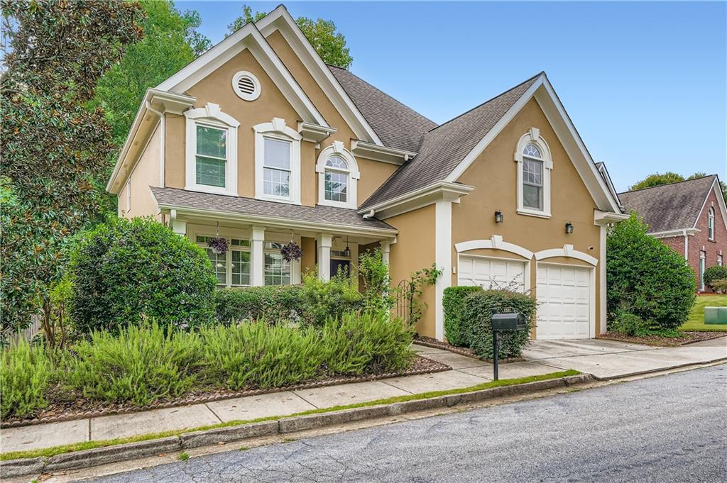 1581 Oak Park Cove Decatur, GA 30033 - Photo 2 of 32 a front view of a house with a yard