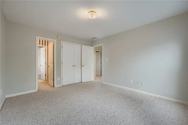a view of an empty room and a window