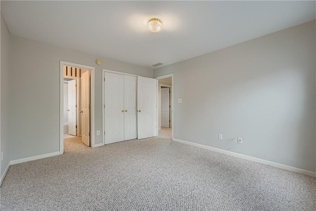 1581 Oak Park Cove Decatur, GA 30033 - Photo 21 of 32 a view of an empty room and a window