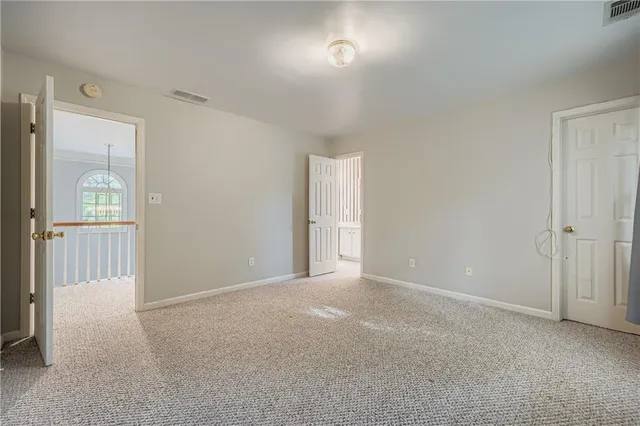a view of an empty room and a window