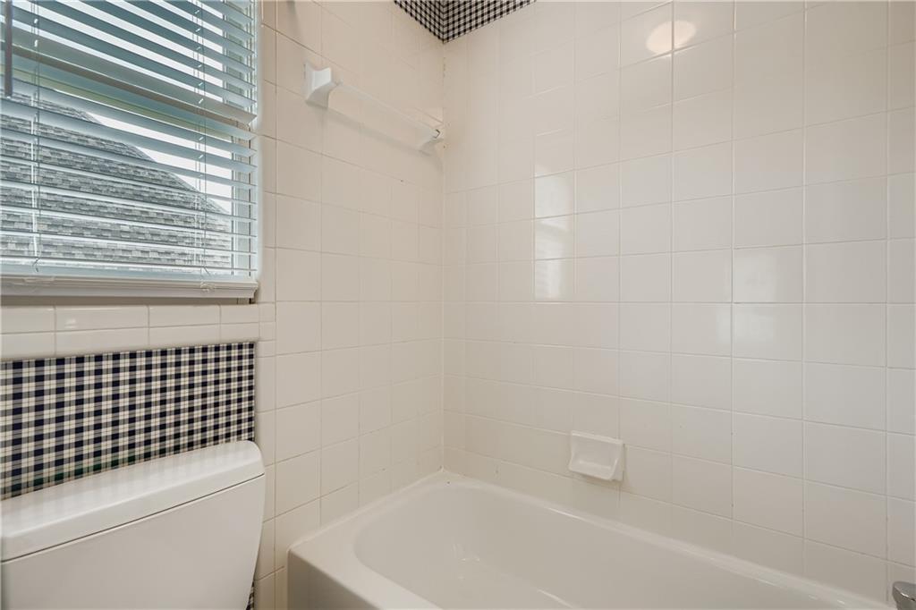 1581 Oak Park Cove Decatur, GA 30033 - Photo 26 of 32 a bathroom with a shower and a bathtub