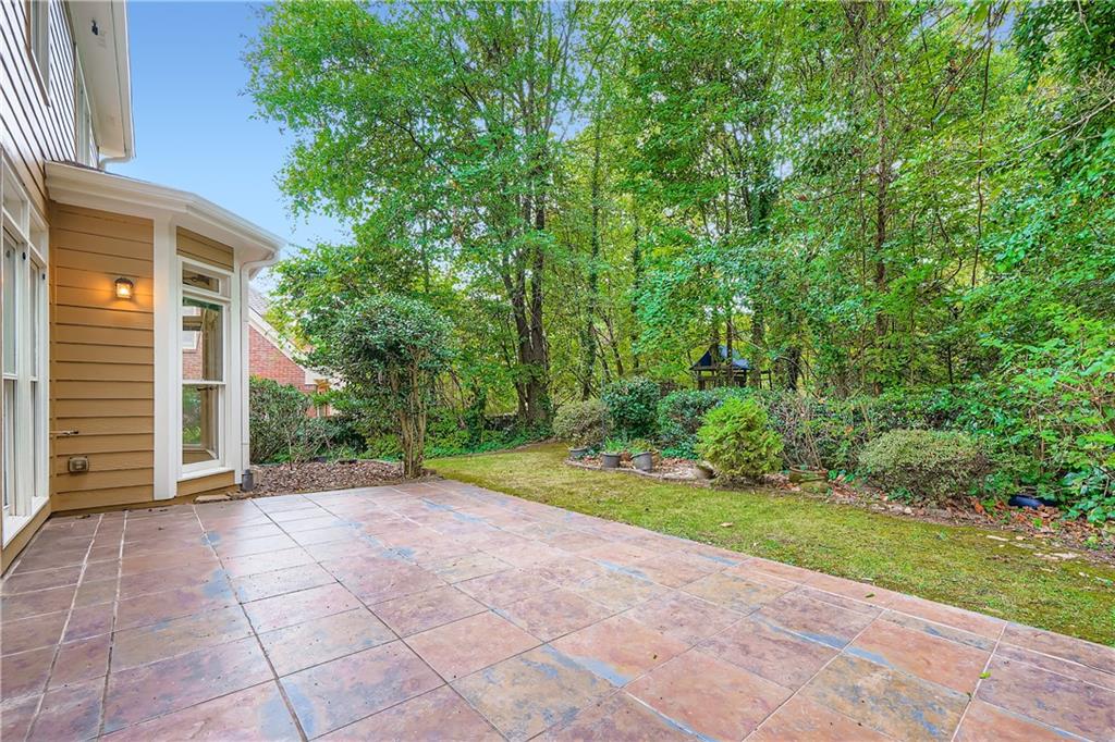 1581 Oak Park Cove Decatur, GA 30033 - Photo 27 of 32 a view of a backyard with potted plants and large trees