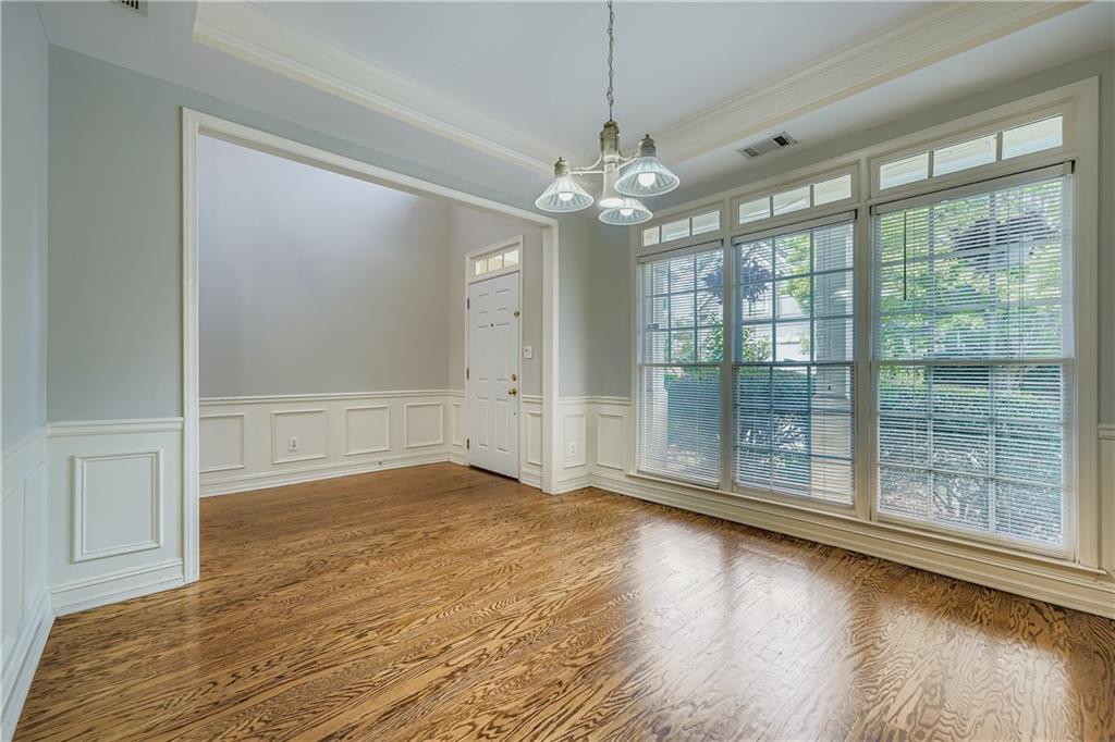 1581 Oak Park Cove Decatur, GA 30033 - Photo 8 of 32 a view of a livingroom with wooden floor and a large window