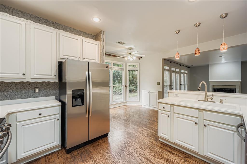 1581 Oak Park Cove Decatur, GA 30033 - Photo 10 of 32 a kitchen with stainless steel appliances a refrigerator sink and cabinets