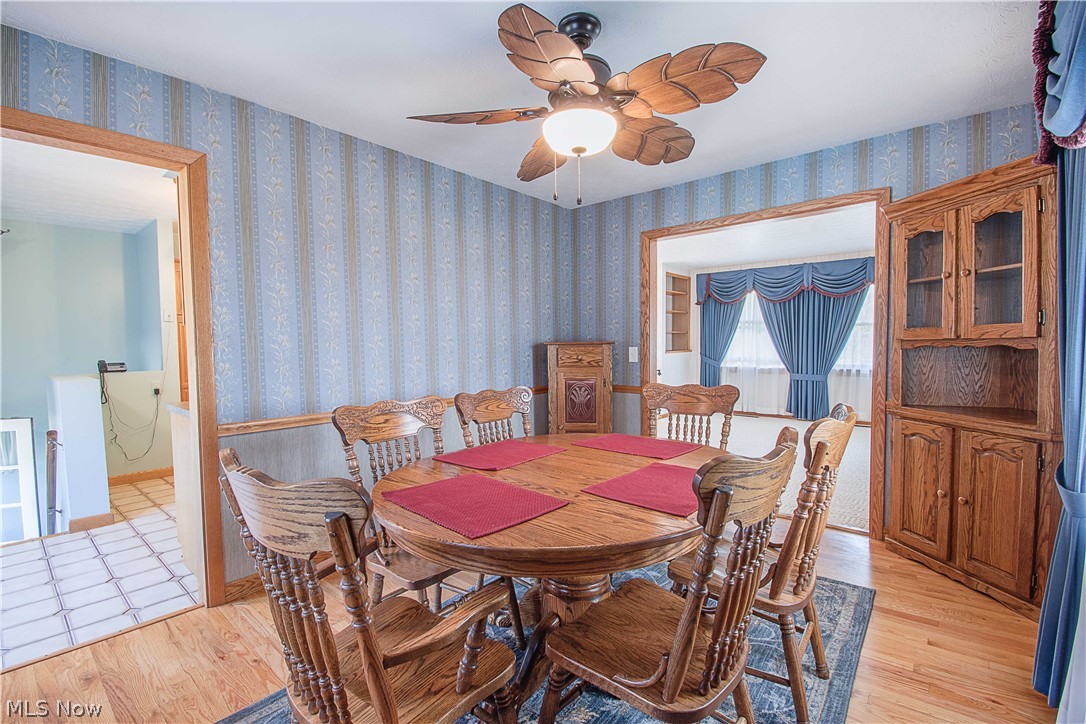 1272 Stewart Road Salem, OH 44460 - Photo 10 of 30 The formal dining room has hardwood floors and nice ceiling fan.