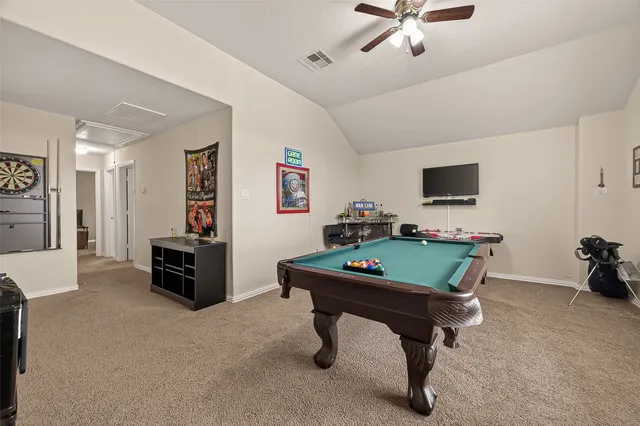 a room with furniture and a flat screen tv