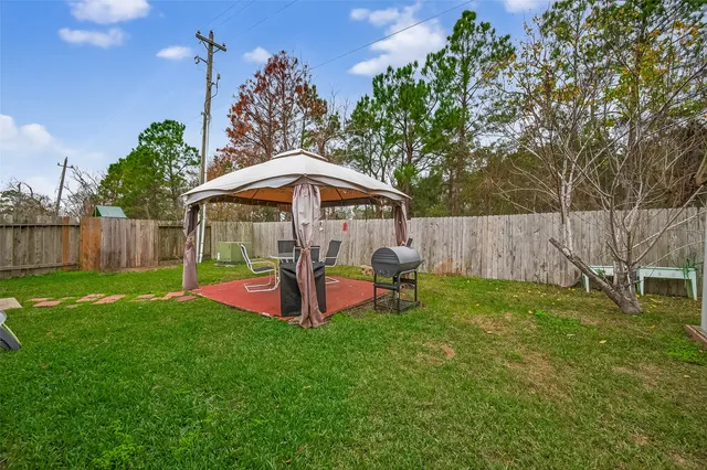 a view of a backyard with a trampoline