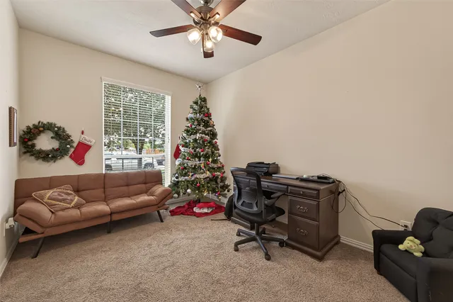 a livingroom with a couch and a window
