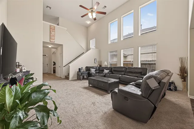 a living room with furniture a chandelier