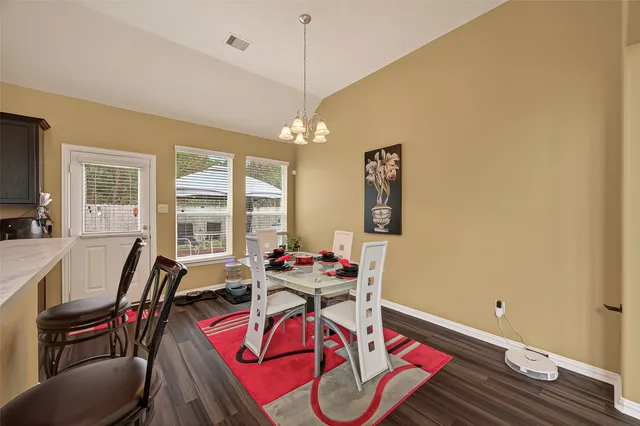 a view of a dining room with furniture window and outside view