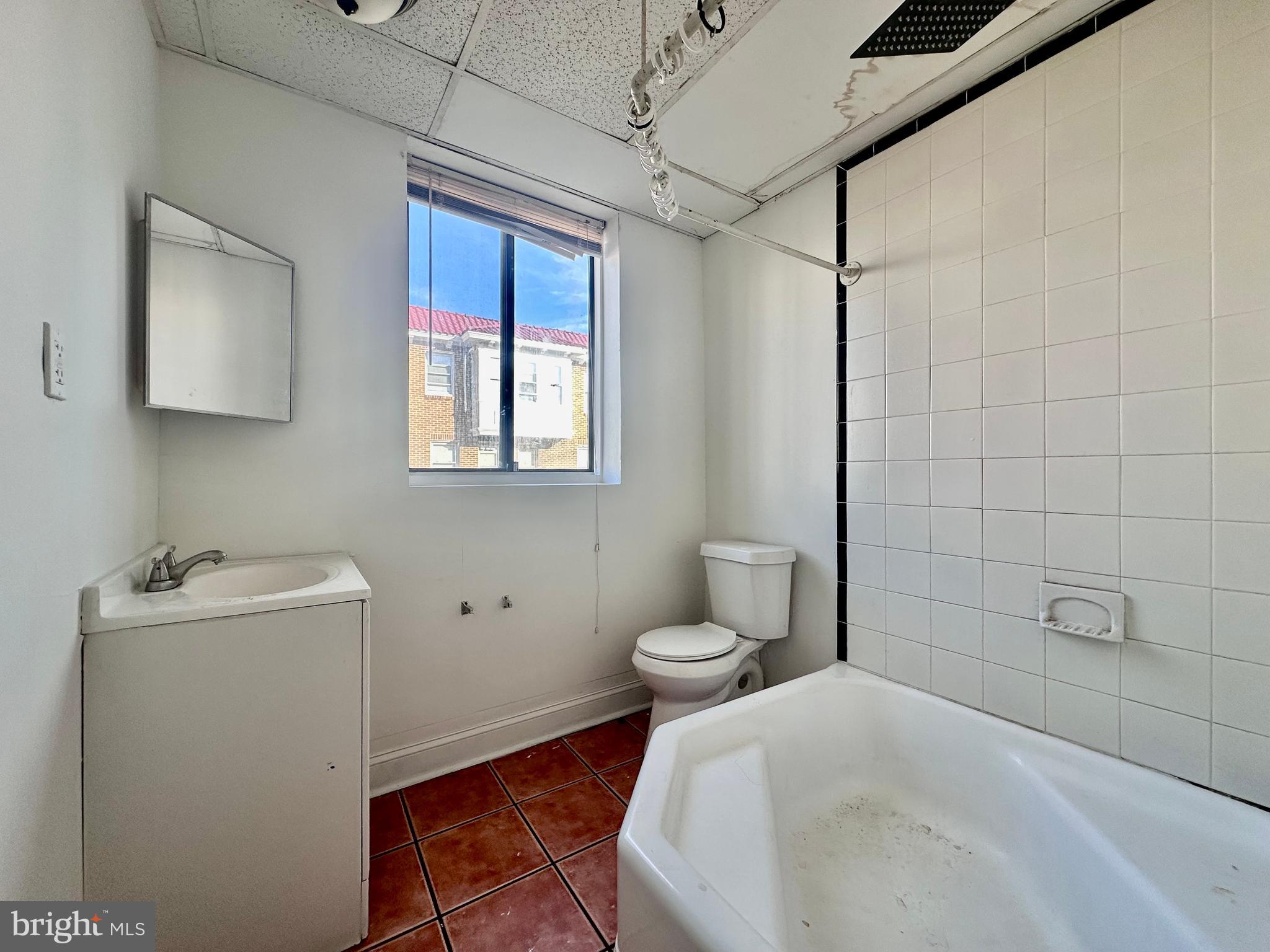 4060 East Roosevelt Boulevard Philadelphia, PA 19124 - Photo 13 of 13 a bathroom with a sink toilet and shower