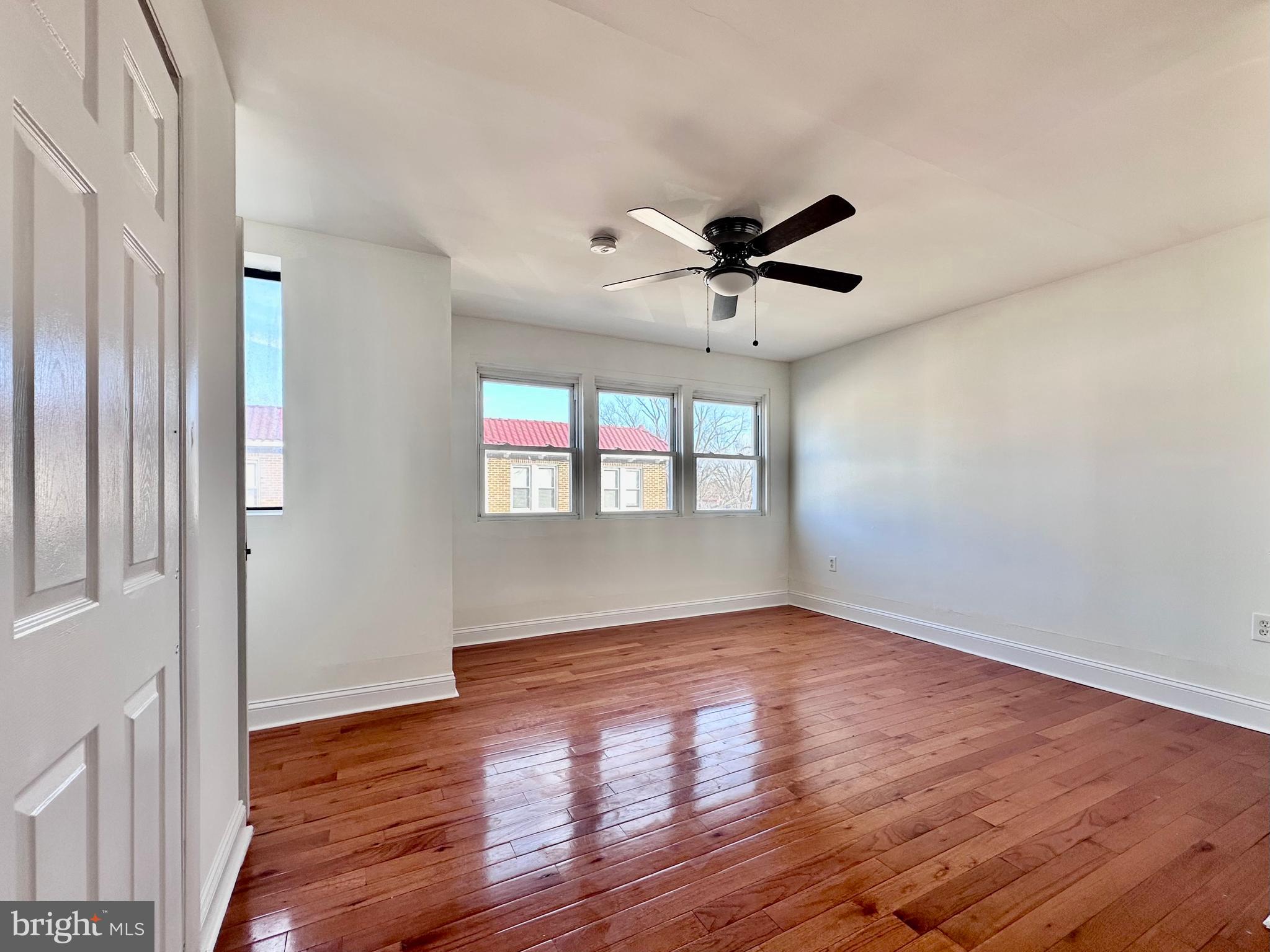 4060 East Roosevelt Boulevard Philadelphia, PA 19124 - Photo 2 of 13 a view of an empty room with wooden floor and a window