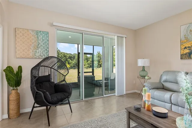a living room with furniture and a large window